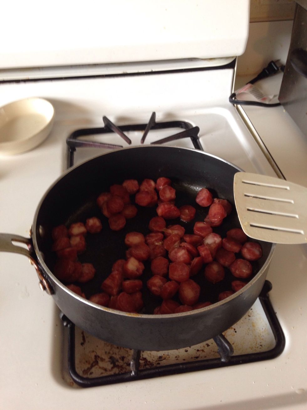 Saut\u00e9 Chinese sausage jst enough to bring out the aroma and color. No oil necessary. The sausage is fatty enough