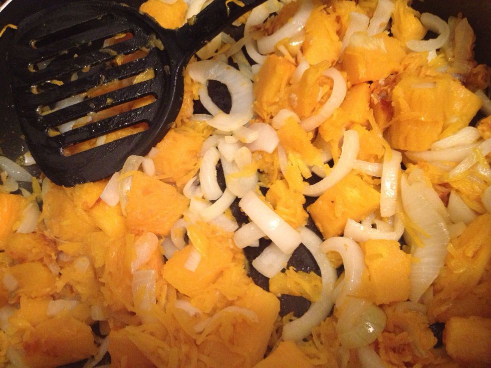 Saut\u00e9 crushed garlic in oil. We used 5 cloves. Use what you'd like. It would have been better to caramelize the onions 1st before adding pumpkin but we didn't. When pumpkin is soft this stage is done.