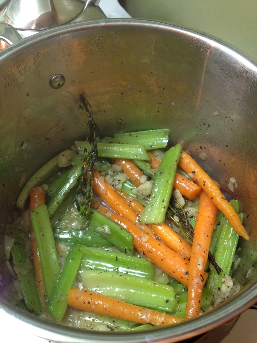 Saut\u00e9 everything together...constantly mixing to make sure nothing burns. You want your veg to start getting soft.