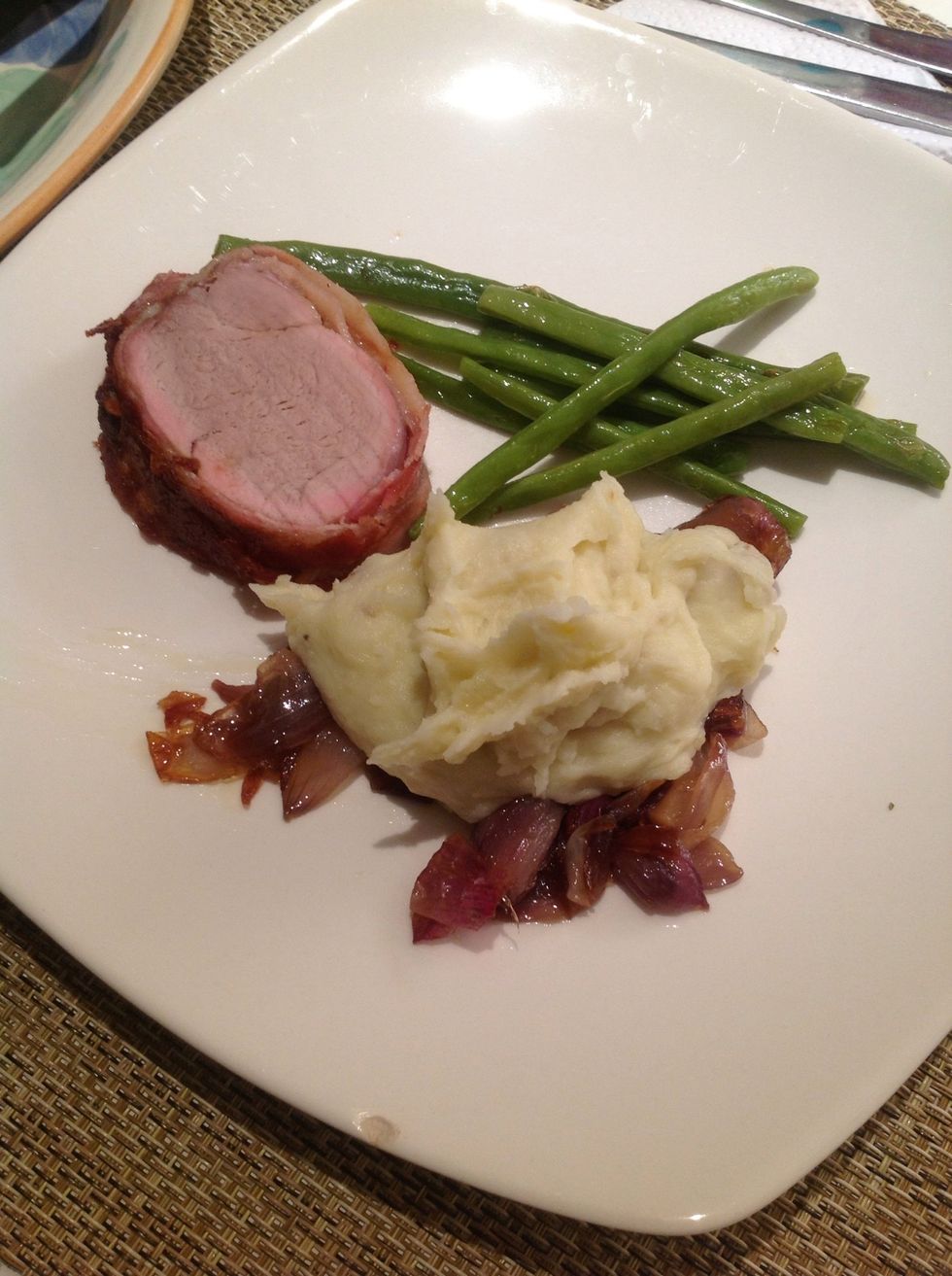 Saut\u00e9 green beans, mash-potatoes on top of caramelized onions and beef tenderloin wrapped in smoked bacon