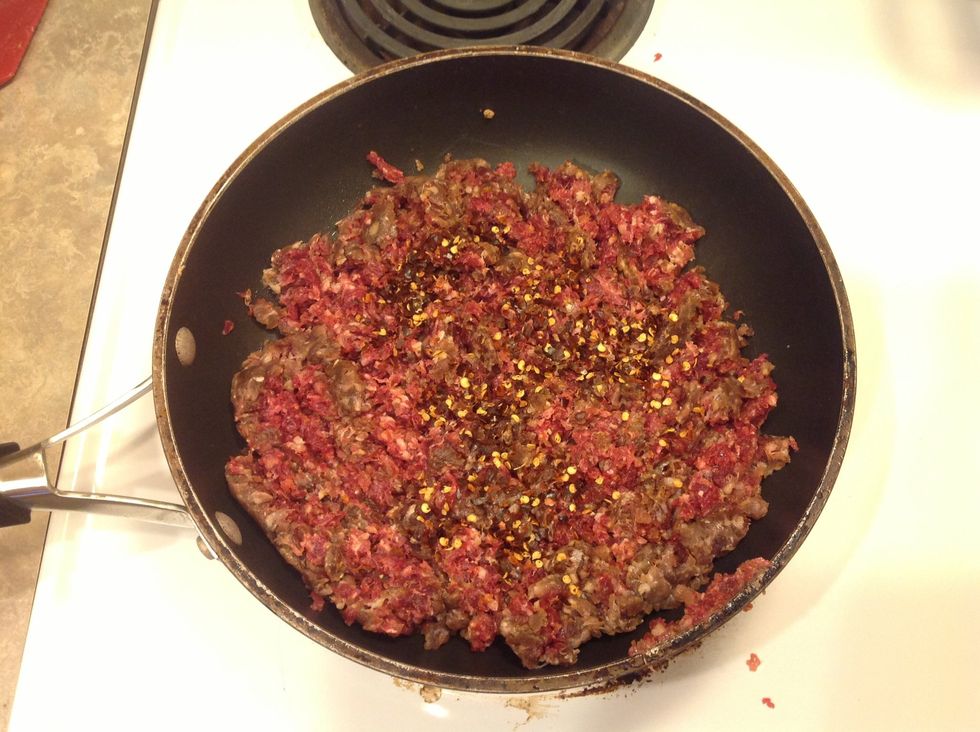 Saut\u00e9 Italian sausage and crushed red pepper in a large pot. Drain excess fat, refrigerate while you prepare other ingredients.