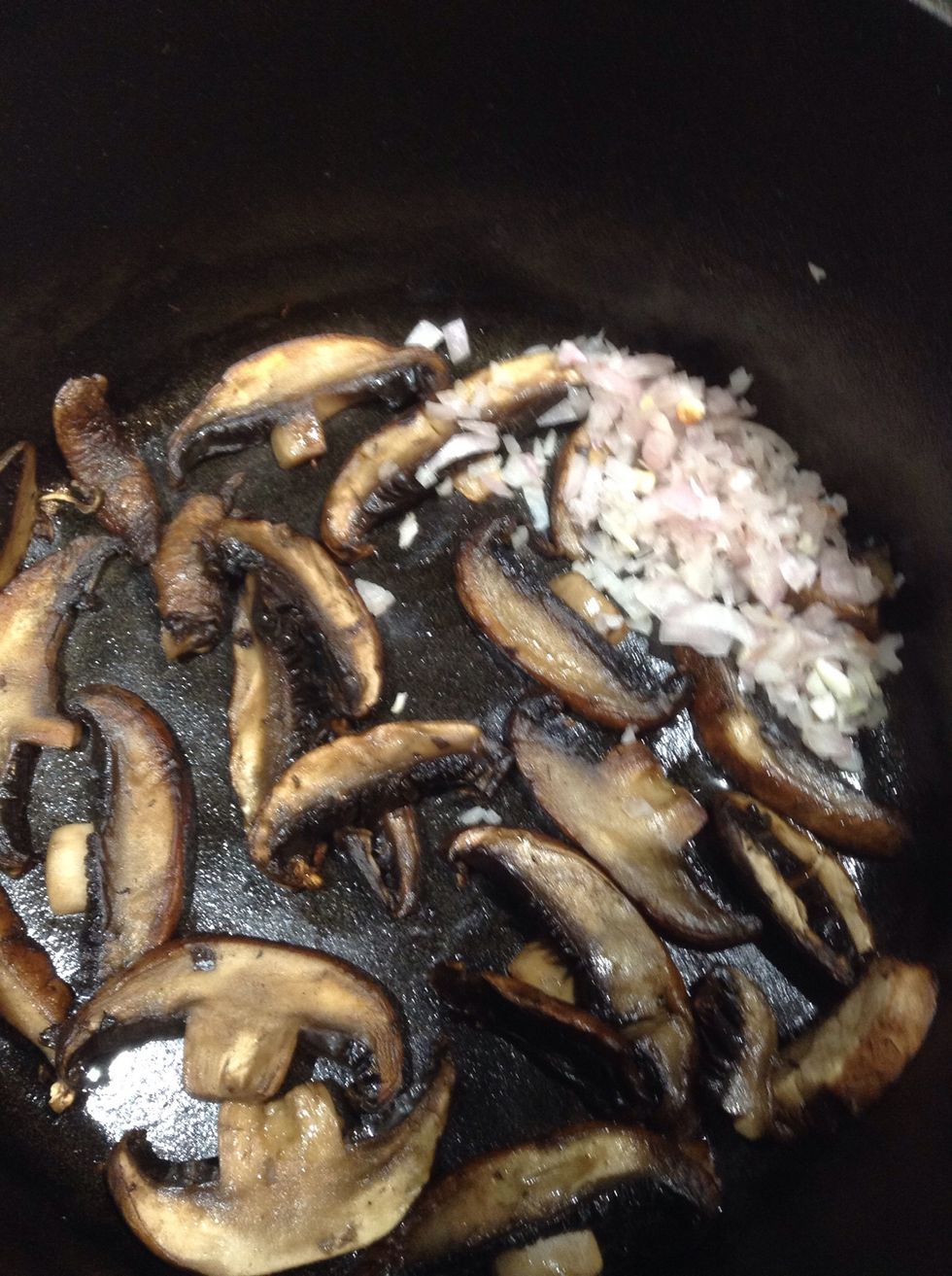 Saut\u00e9 mushroom slices in 2 tbls unsalted butter, when you see a bit of color on the mushroom slices add the shallot and stir cooking 1 minute then add herbs and cook about 30 seconds