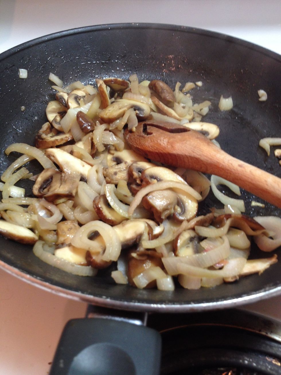 Saut\u00e9 onion and mushrooms in a pan with some olive oil until tender. Set aside.