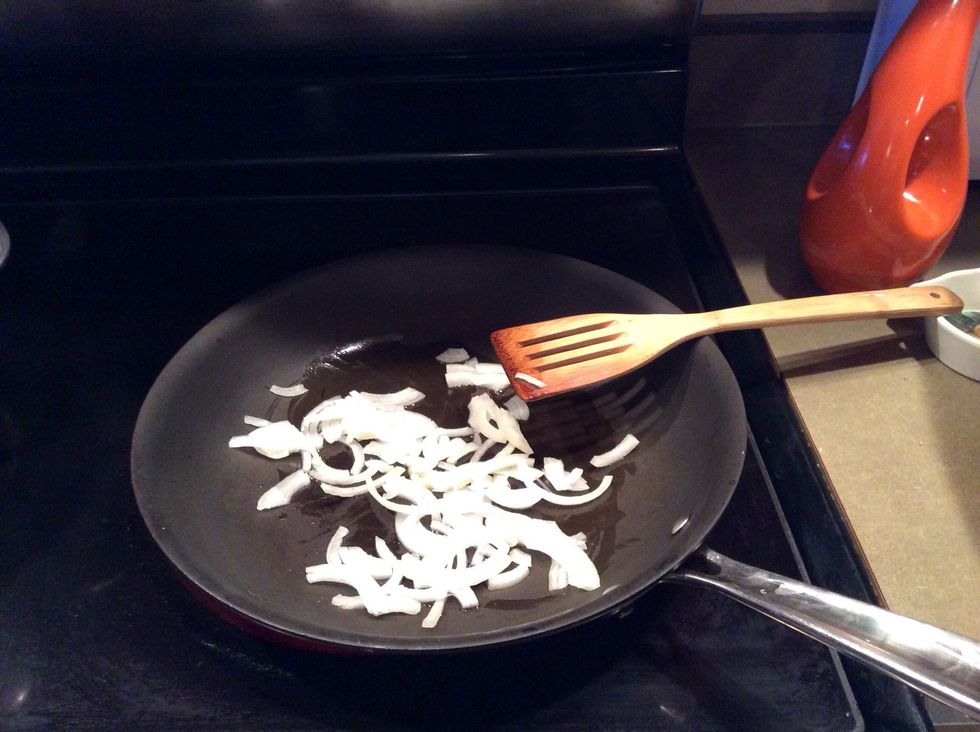 Saut\u00e9 onion in 1 tablespoon of olive oil. Cook until soften over medium heat.