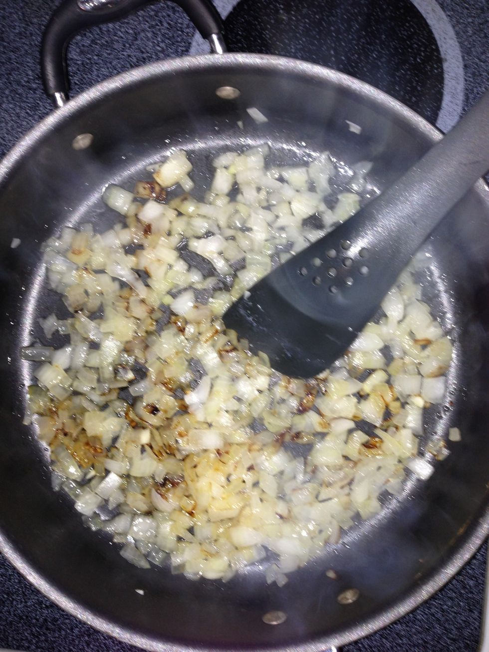 Saut\u00e9 Onion with just a touch of vegetable oil until they just start to turn brown.  You want the onion soft but not soggy.