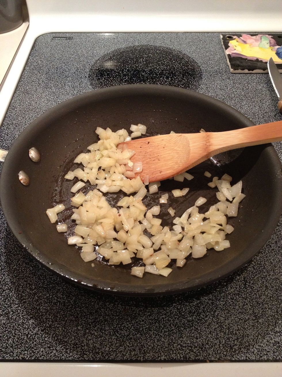 Saut\u00e9 onions in butter until soft.