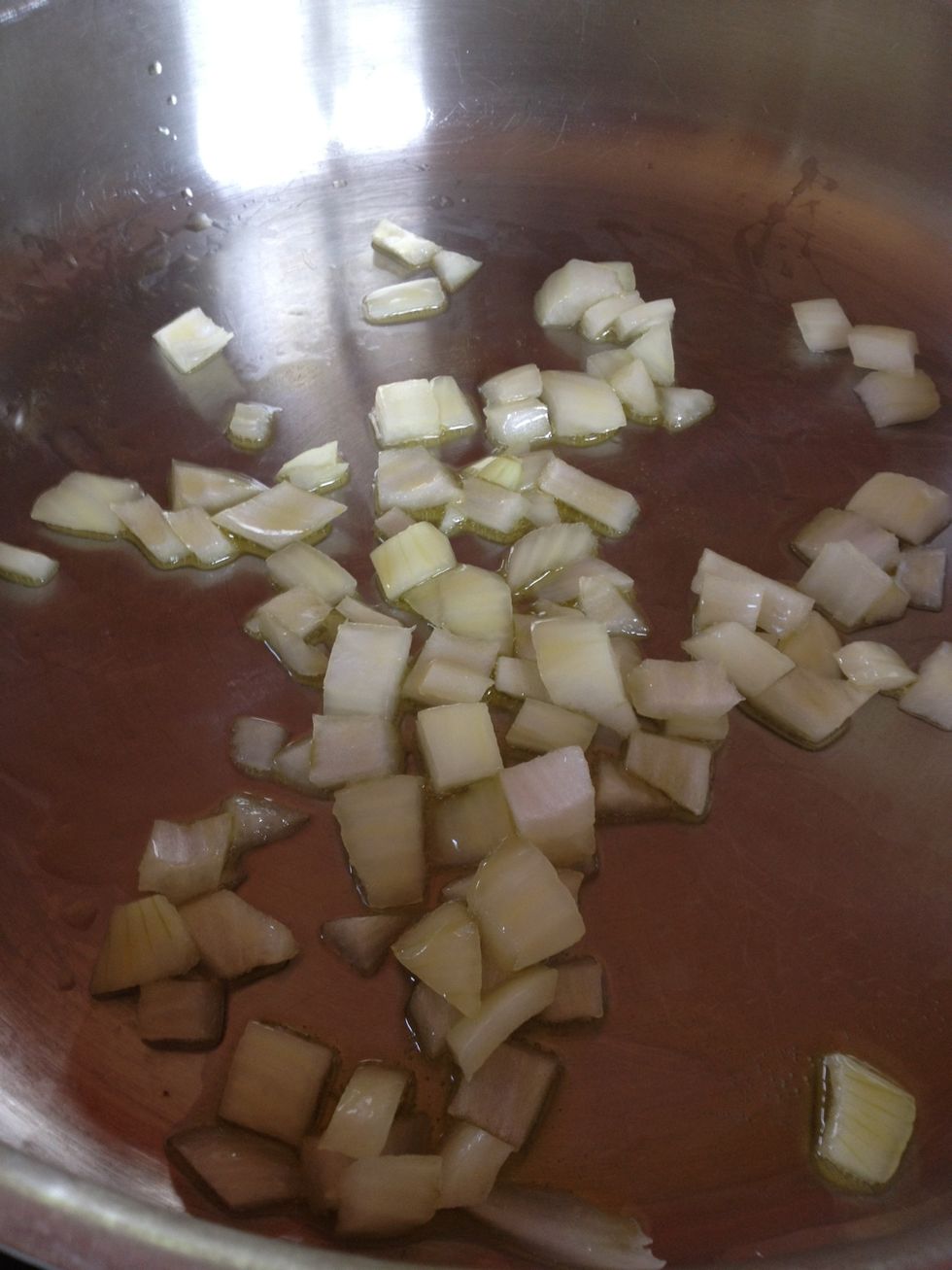 Saut\u00e9 onions in olive oil until translucent