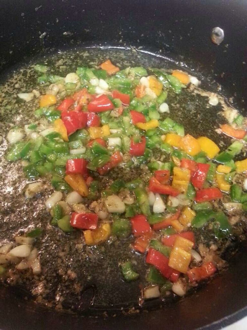 Saut\u00e9 peppers until they are soft