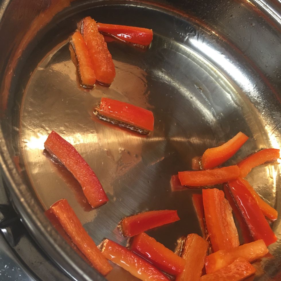 Saut\u00e9 red bell pepper in olive oil. You could also add green bell pepper and onion to the mix.