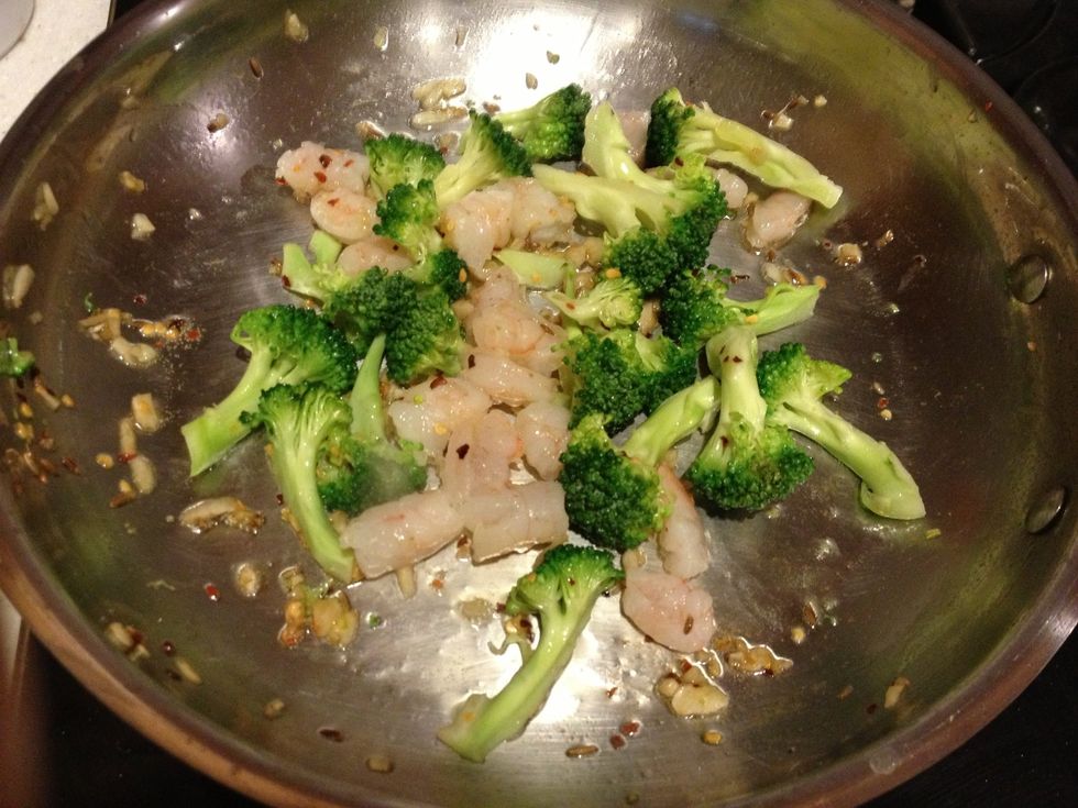 Saut\u00e9 shrimp, garlic, fish oil, and veggies for 3 minutes. I thawed 6 frozen shrimp and cut them into pieces to spread the wealth. Set aside, leave any seasoning remnants and extra oil in the pan.