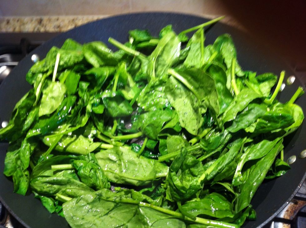 Saut\u00e9 spinach in olive oil and sesame oil for taste. Add a dash of S/P.