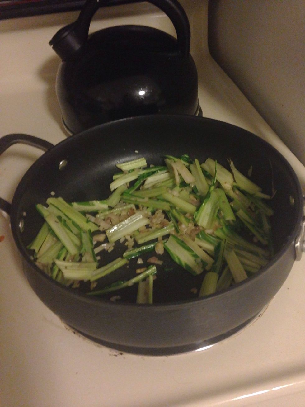 Saut\u00e9 Swiss chard ribs and shallots until tender, 5-8 minutes.