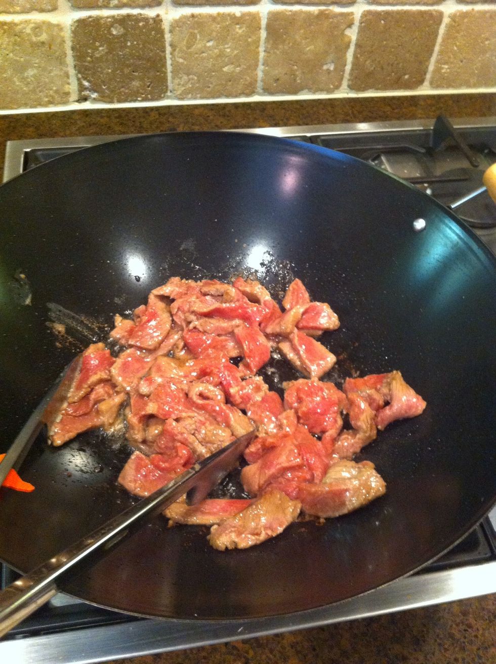 Saut\u00e9 the beef until no longer pink; remove from the wok