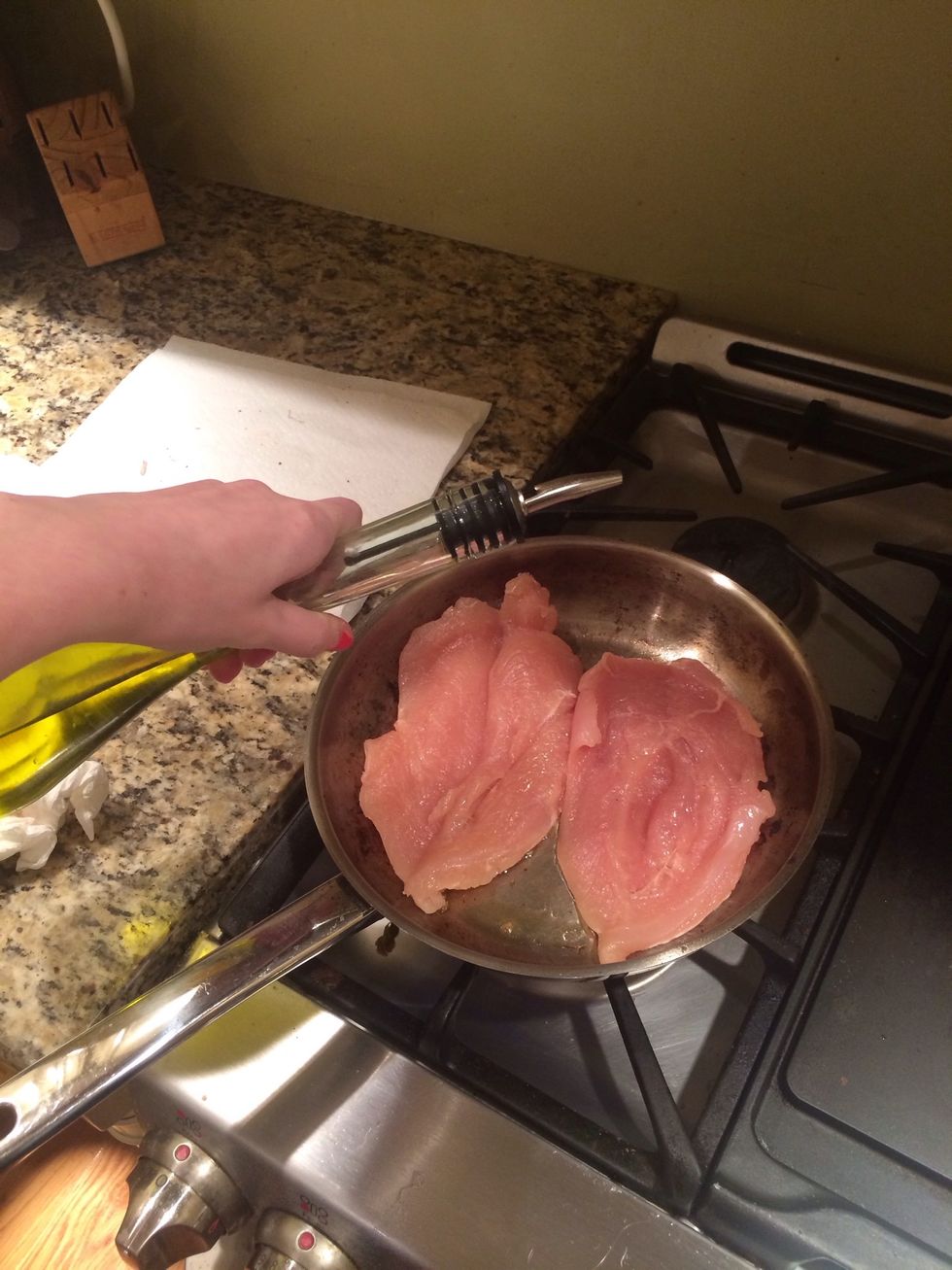 Saut\u00e9 the chicken in olive oil for 2 minutes on each side (don't fully cook it yet)