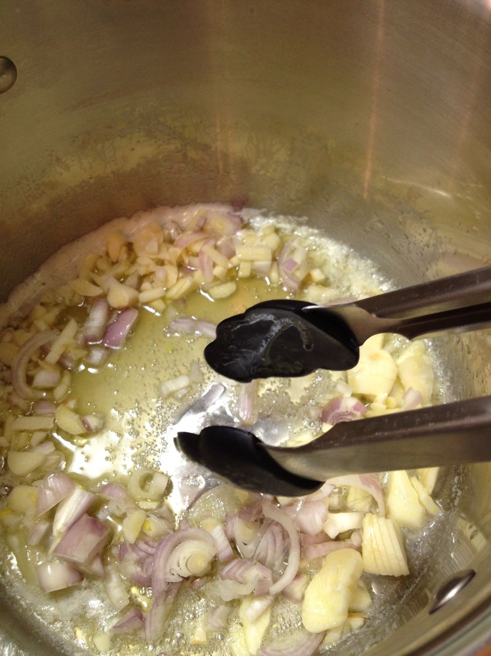 Saut\u00e9 the garlic and shallots in the butter on med-high heat.