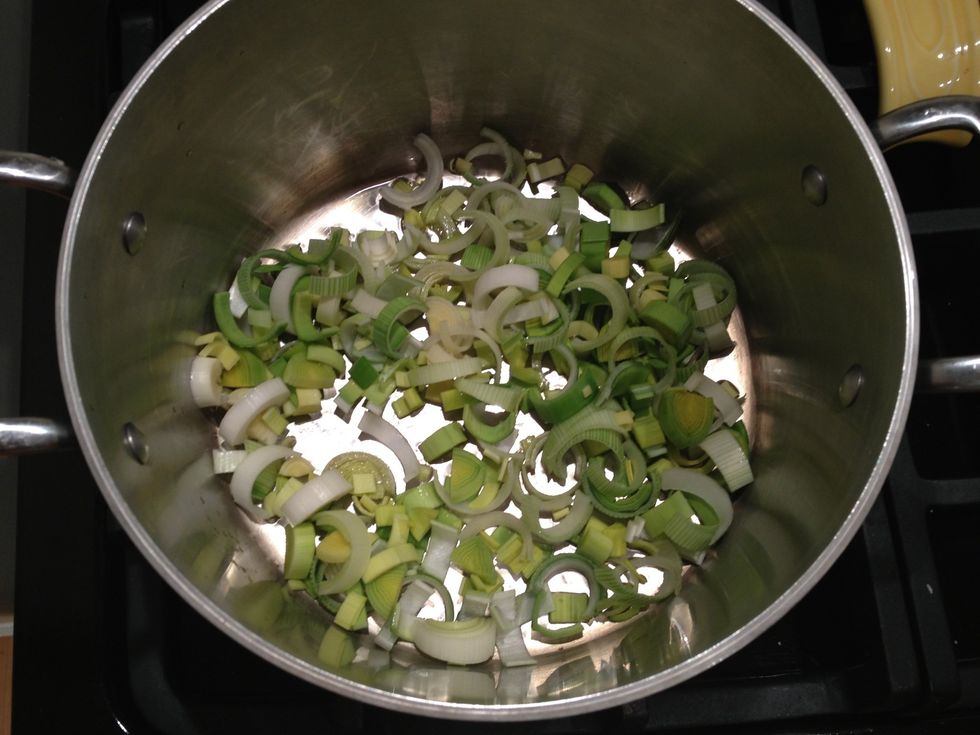 Saut\u00e9 the leek in olive oil until it becomes soft.