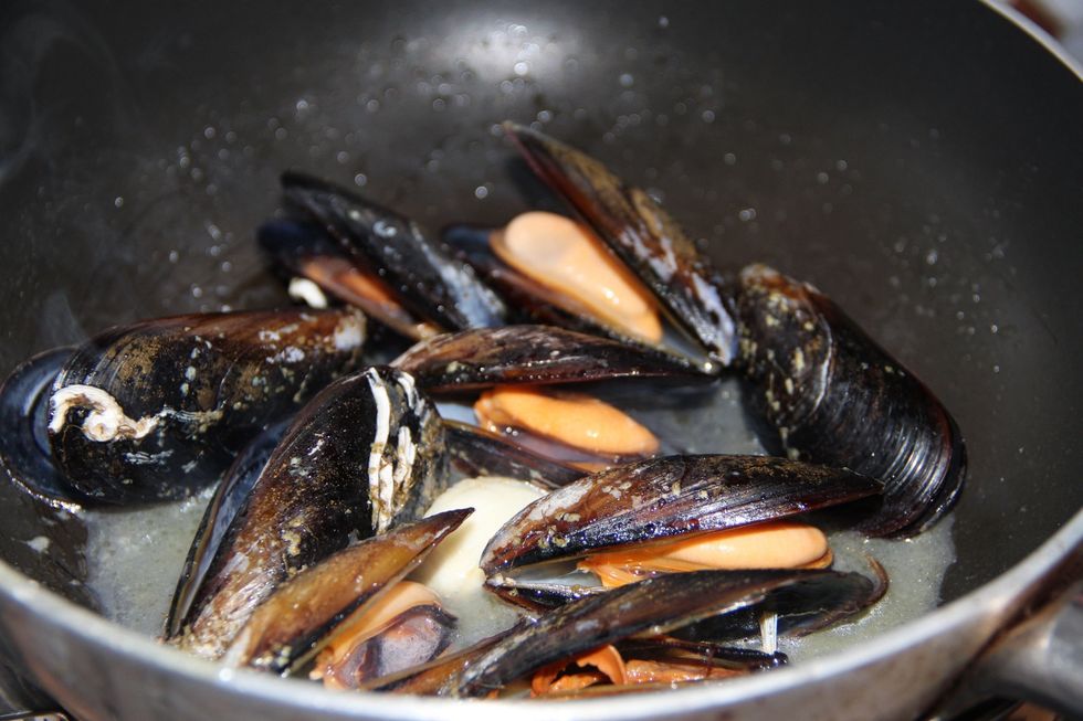 Saut\u00e9 the mussels in pan with drop of olive oil til they open, then turn off heat and let them cool down