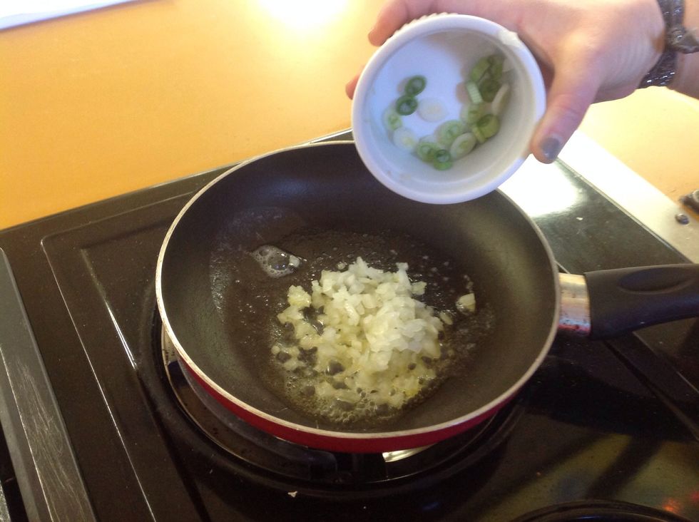 Saut\u00e9 the onion until it is translucent then add only the WHITE and light green part of the scallion to the saut\u00e9ed onion.