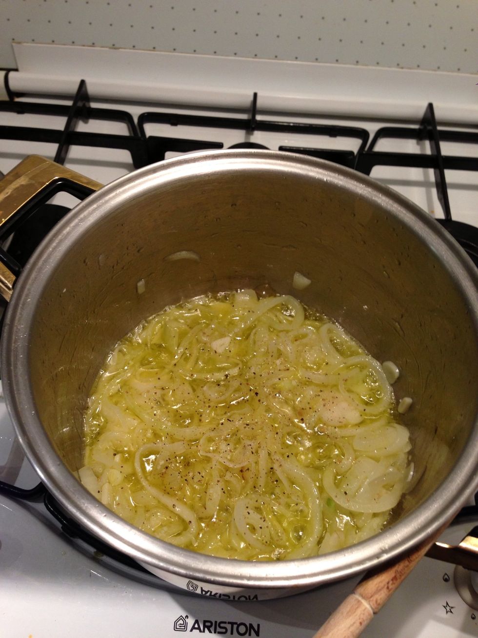 Saut\u00e9 the onions and garlic in low intensity heat and add salt and pepper when they look nice and golden