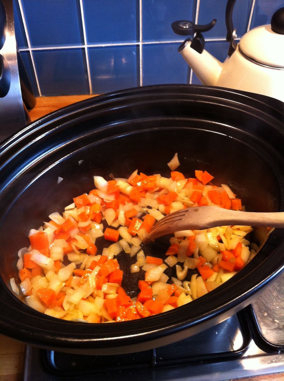Saut\u00e9 the onions & carrots slowly in the olive oil until the onions are soft - 15 mins or so.