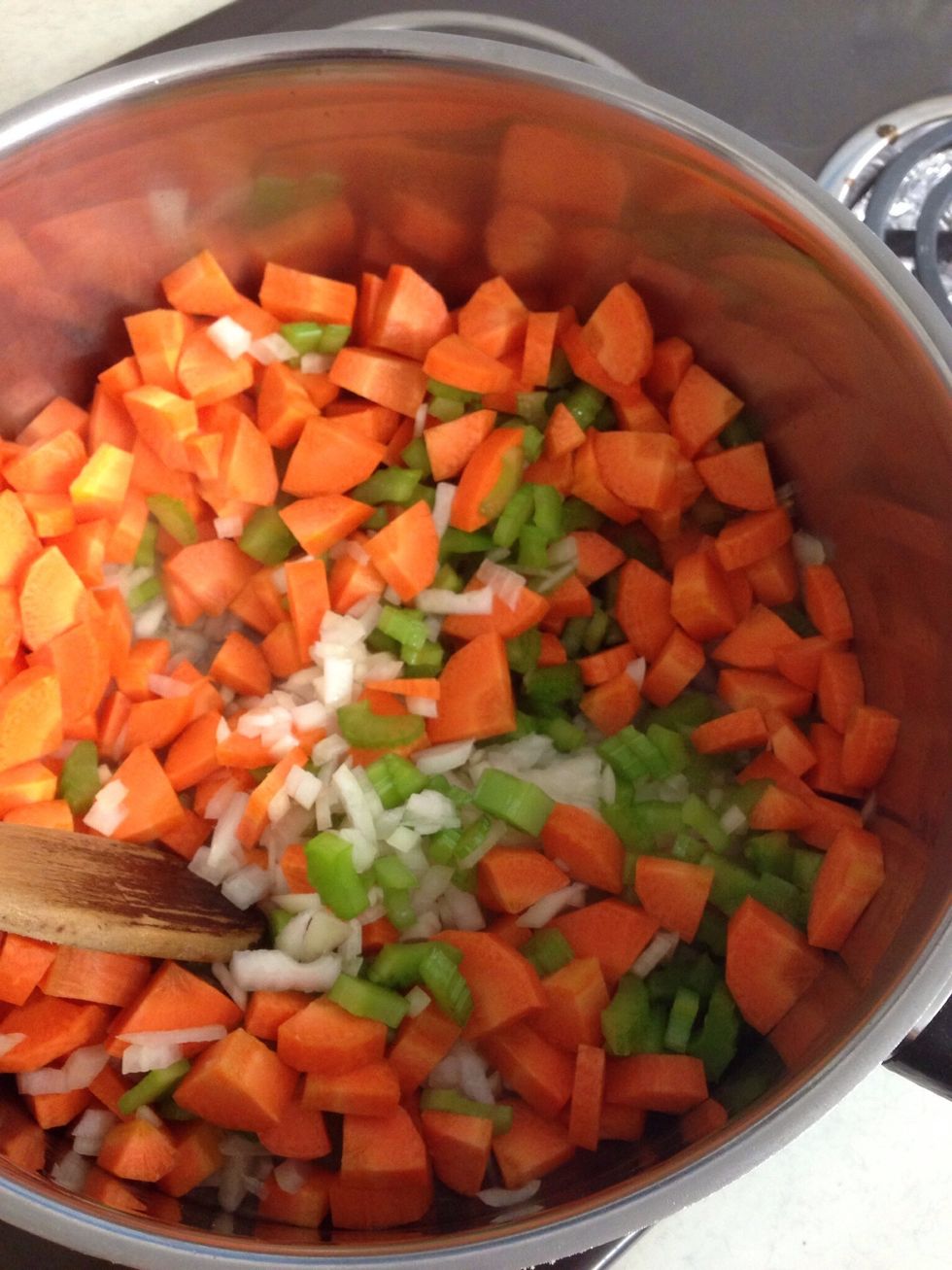 Saut\u00e9 the onions, celery and carrot in some olive oil until the onion is tender