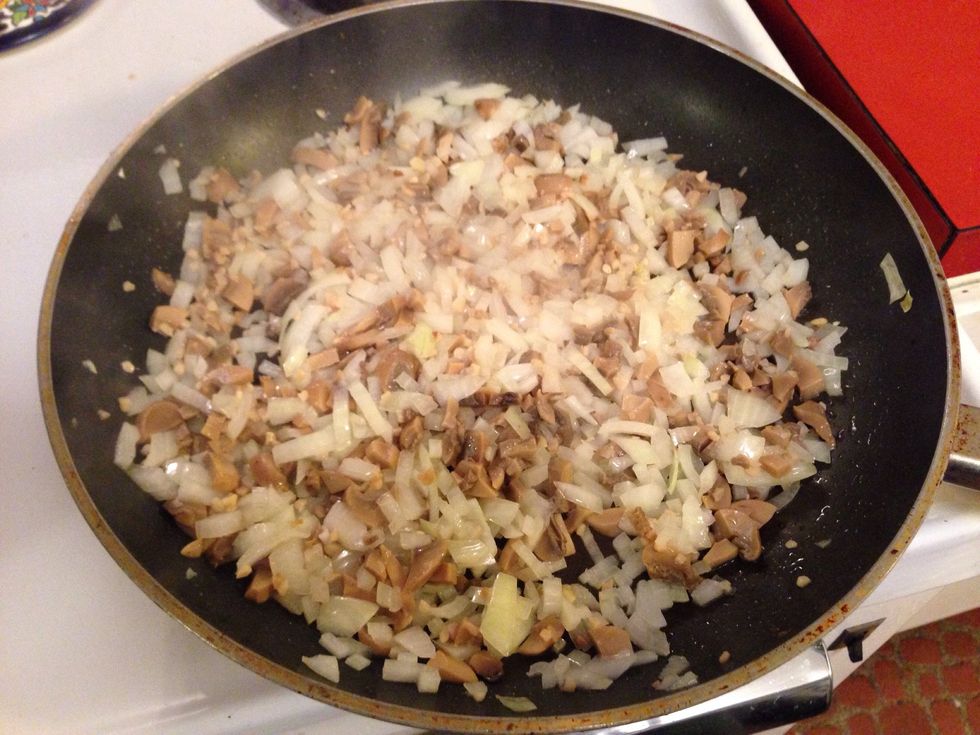 Saut\u00e9 the onions, garlic and mushrooms until the onions start to look clear and smooth.