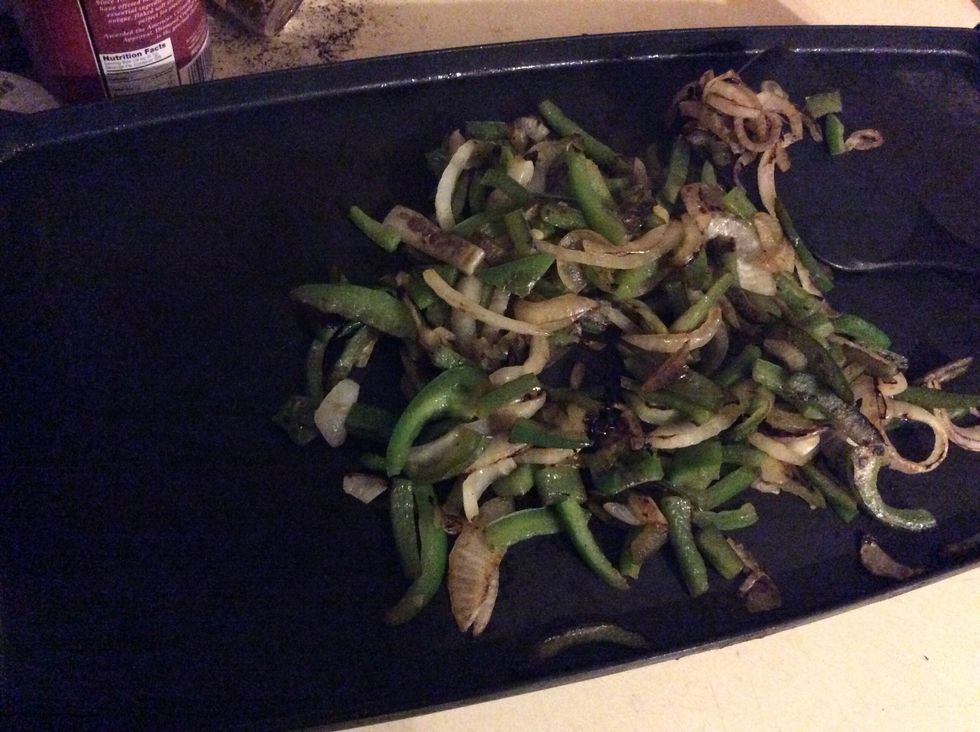 Saut\u00e9 the peppers and onion until lightly brown