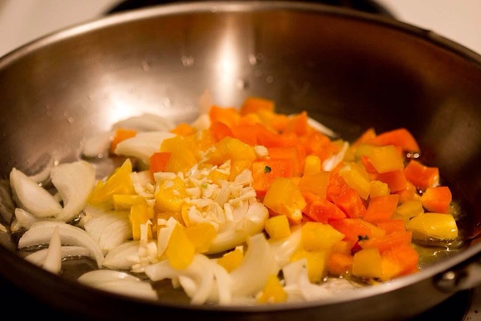 Saut\u00e9 the peppers, garlic and onion in a little oil.