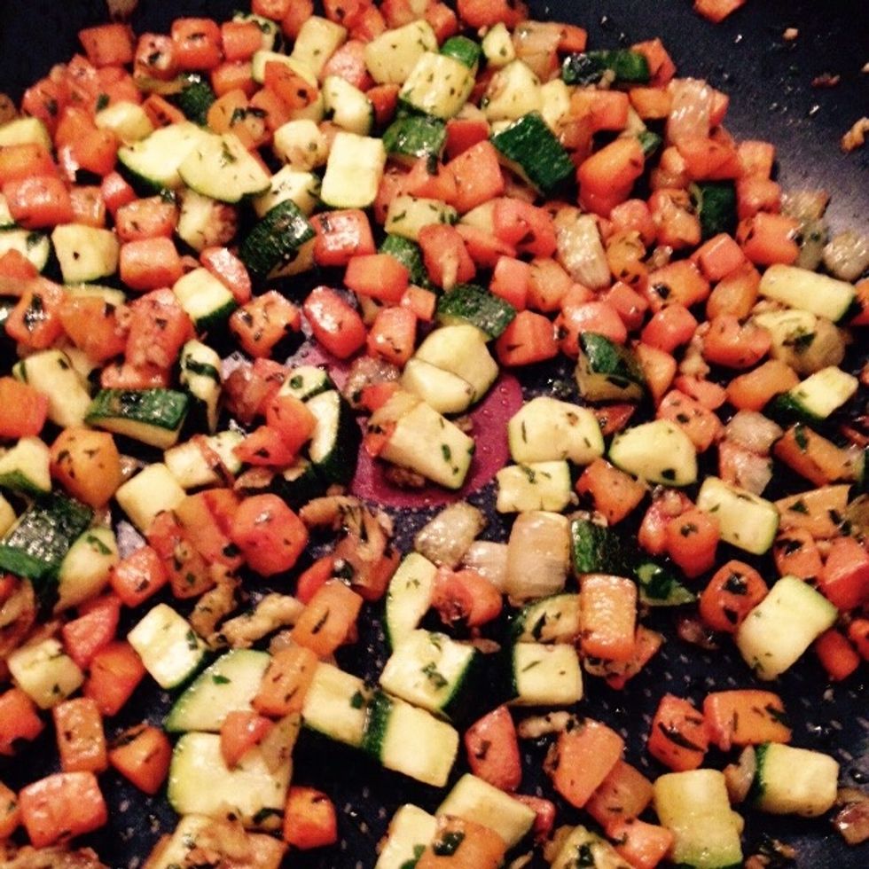 Saut\u00e9 until courgette are tender and roasted on the outside. Adjust water and heat to control the cooking pf the courgettes.