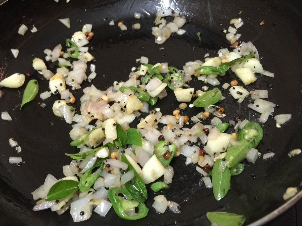 Saut\u00e9 well then add curry leaves