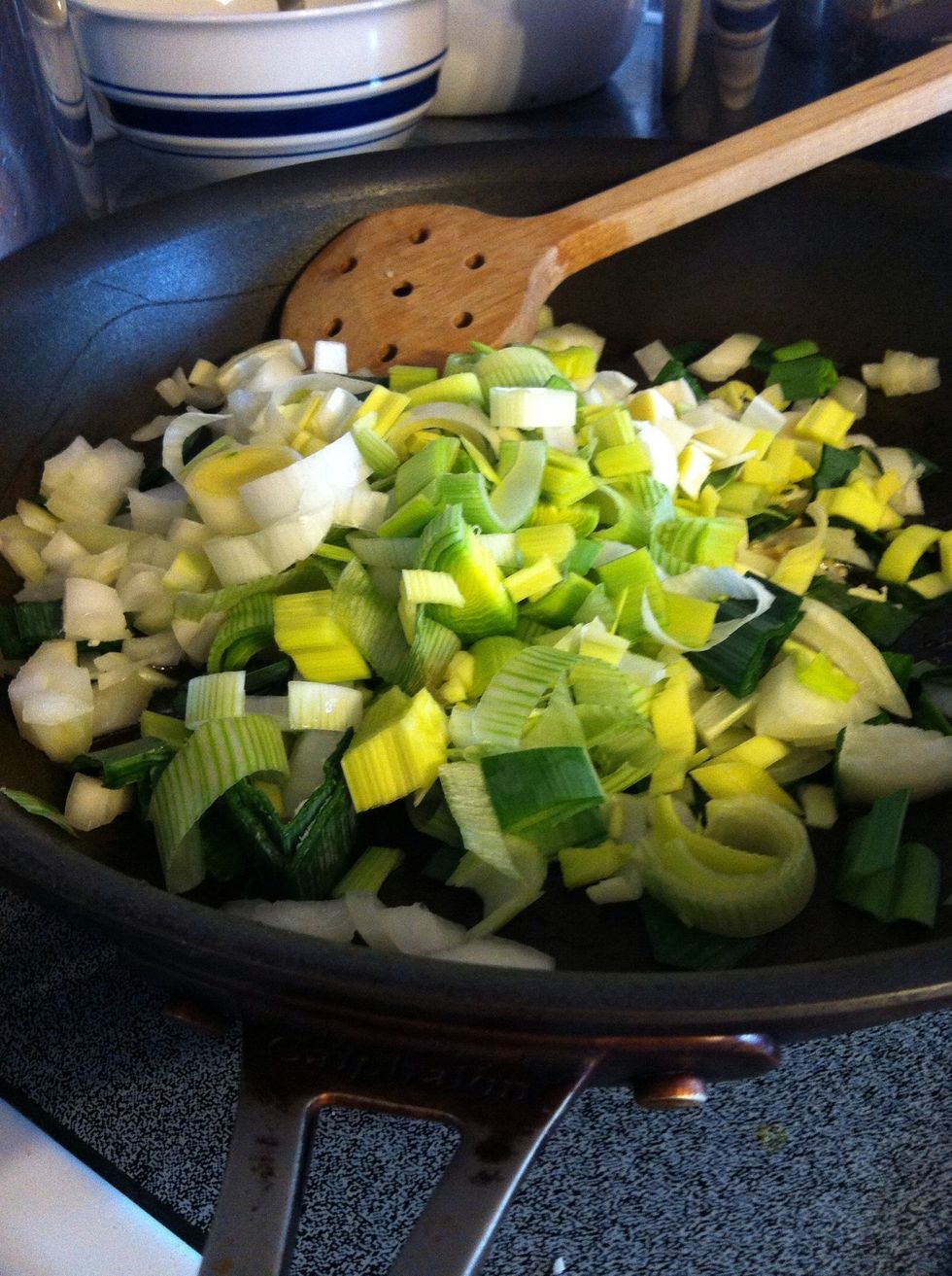 Saut\u00e9 with butter or oil-chopped onion, leeks, and garlic until softened