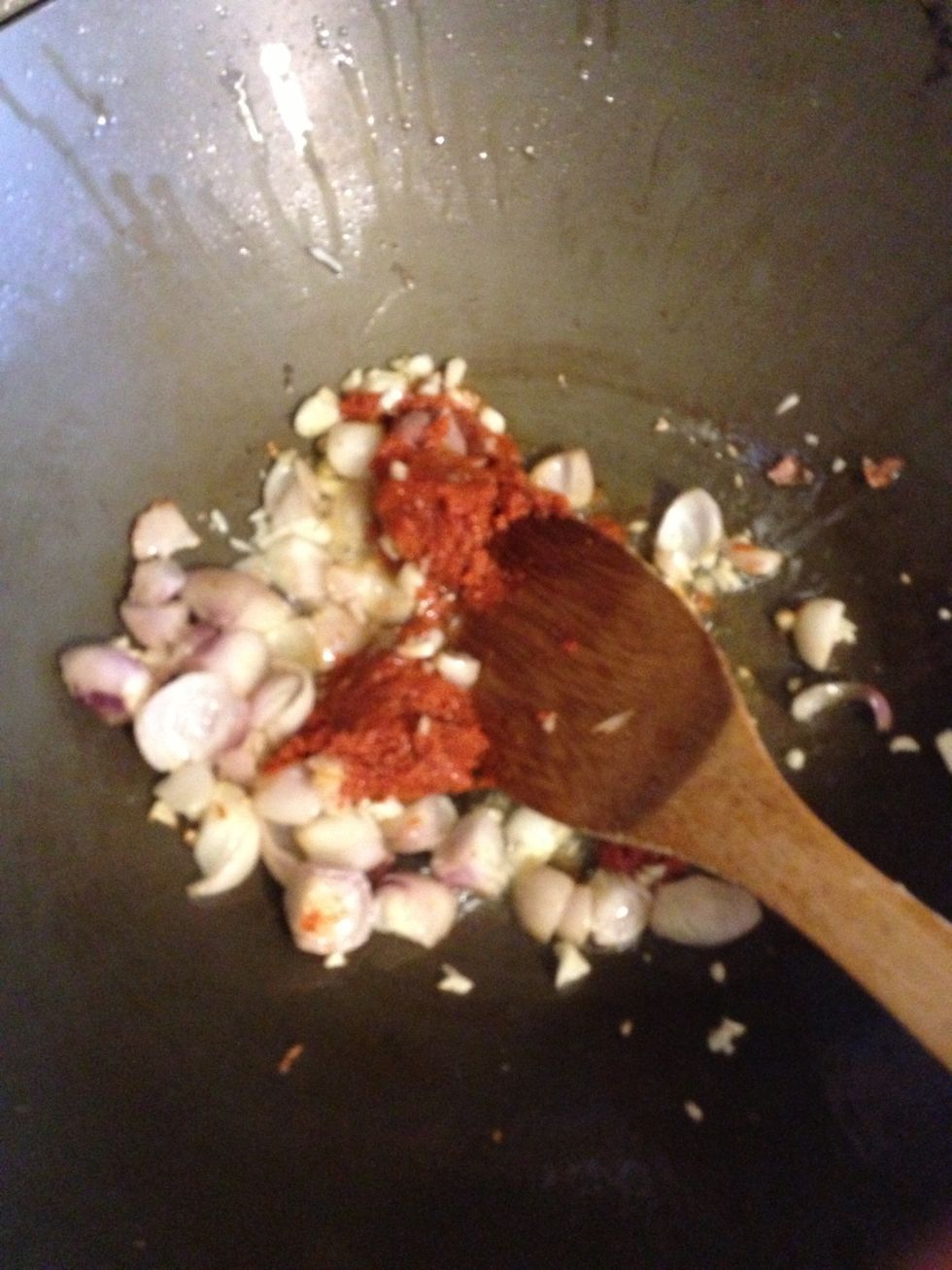 Saut\u00e9 your curry paste garlic oil and shallots. It should begin to smell good.