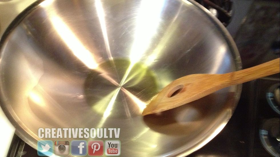 Saut\u00e9 your wok or pan to coat it with the olive oil.