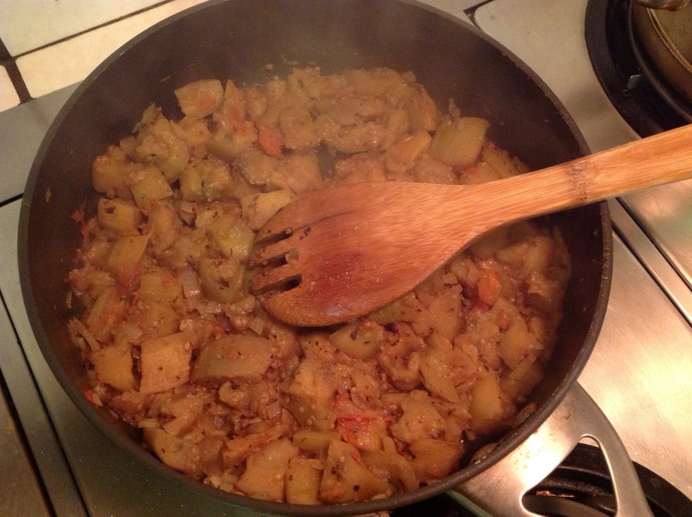 Saut\u00e9e diced eggplant tomato onion in olive oil and butter until very soft. Add 1/4 cup water at a time once or twice until eggplant breaks down nicely. You want utterly sublime mush.