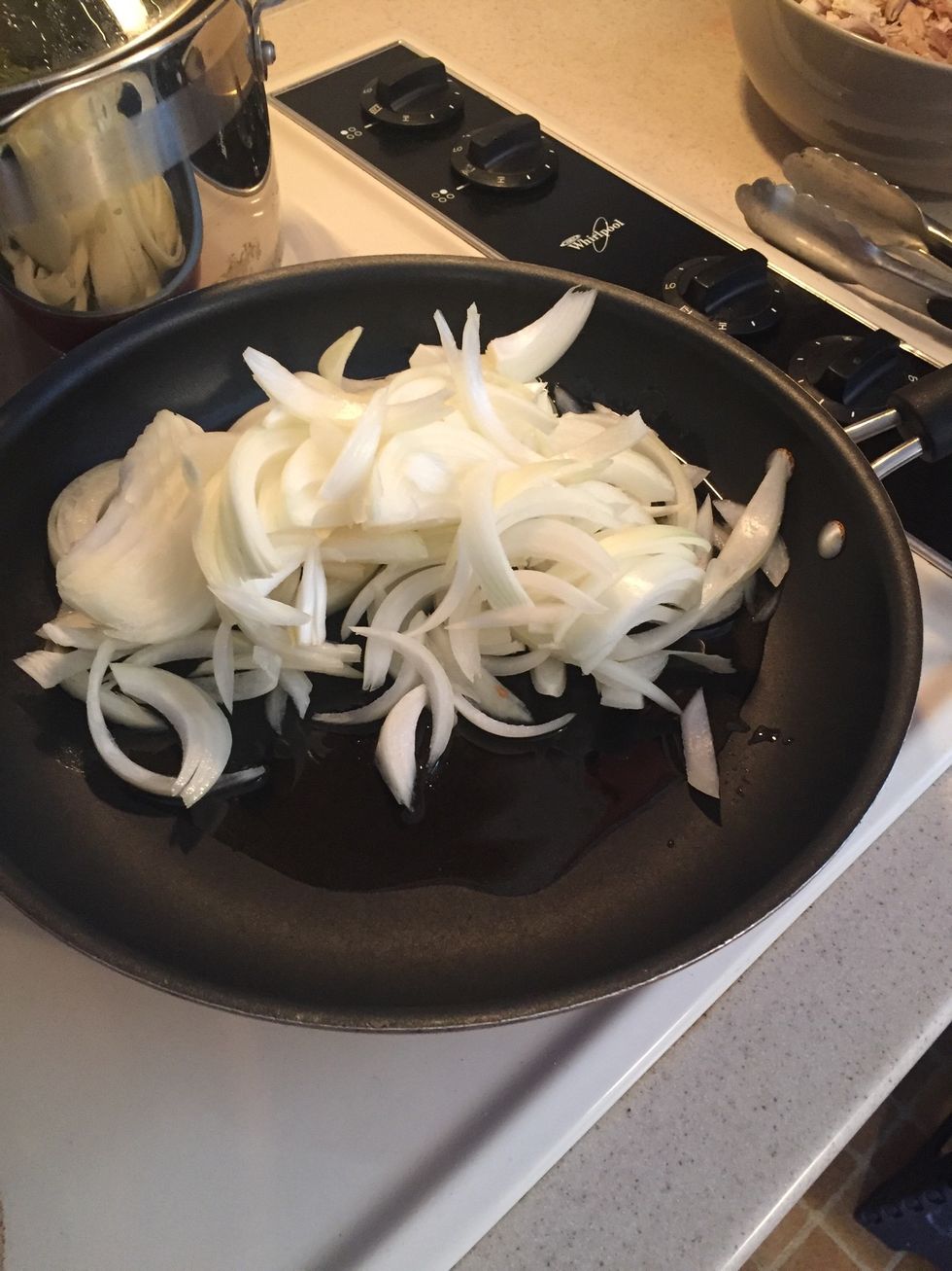 Saut\u00e9e onions in olive oil for 2-3 minutes