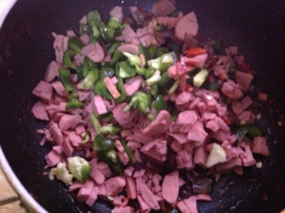 Saut\u00e9e the green pepper and franks