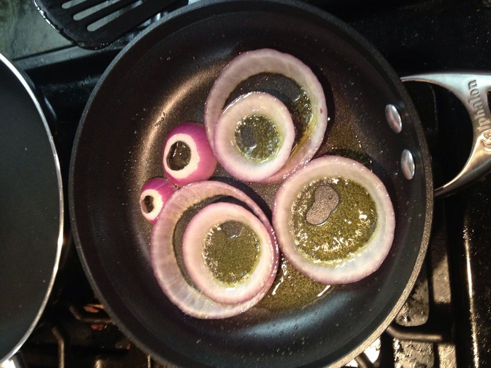 Saut\u00e9e the onions in olive oil on medium-low heat for 5 minutes.