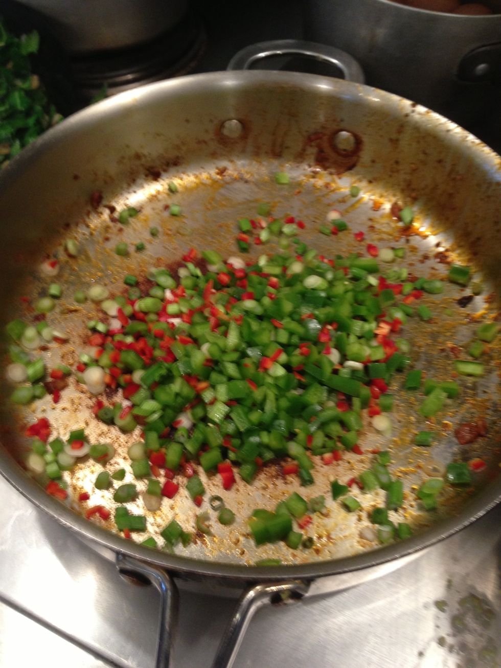 Saut\u00e9ed scallions peppers and garlic in same pan, add splash of oil if needed