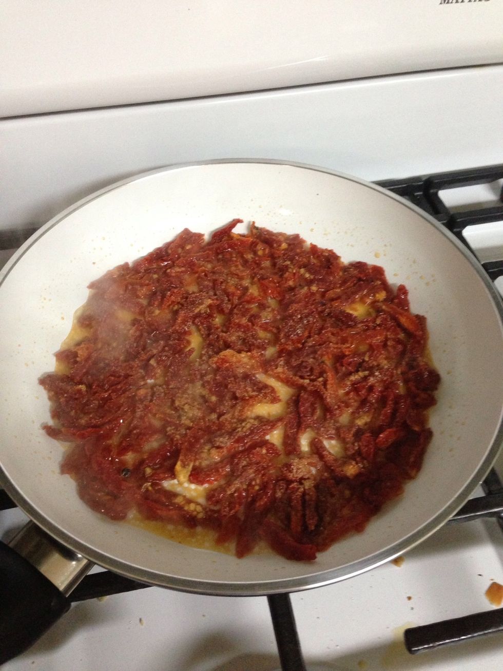 Saut\u00e9ed sun dried tomatoes in. Butter and oil. Once hot ad 1/2 cup water and simmer until almost gone then as remaining water and simmer. Tomatoes will hydrate and water will become red.