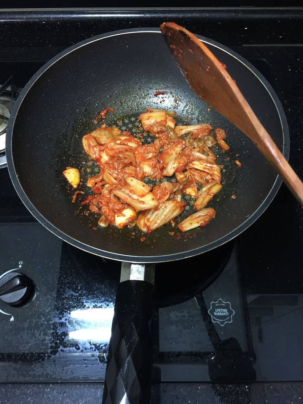 Saute for 5-10 minutes on medium heat or until kimchi is cooked completely. If kimchi starts to stick to the bottom but not cooked through yet, add a little bit of water or more kimchi juice.