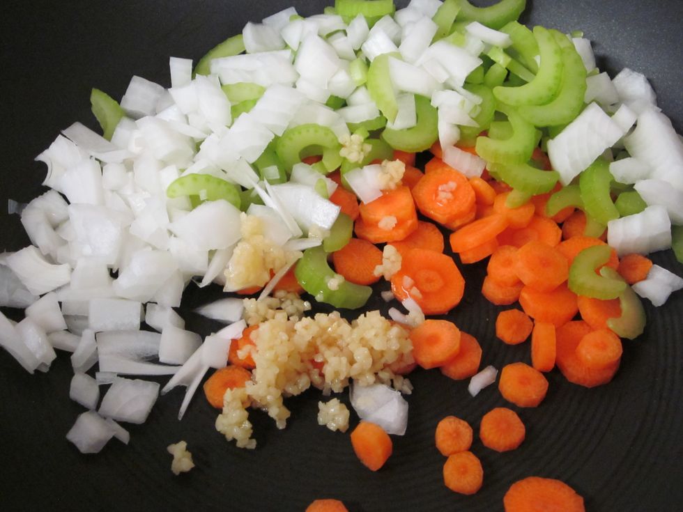 Saute the carrots, celery, onion, and garlic into a medium size sauce pan with a little bit of olive oil.