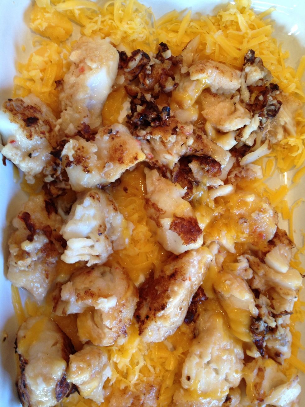 Saute the fish and shredded the cheddar cheeses.