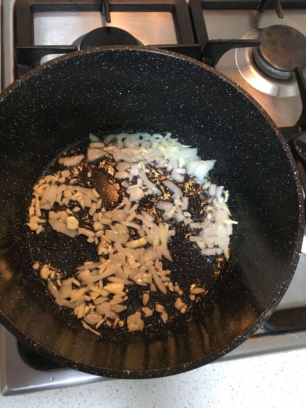 Sautee garlic and onion together until golden brown