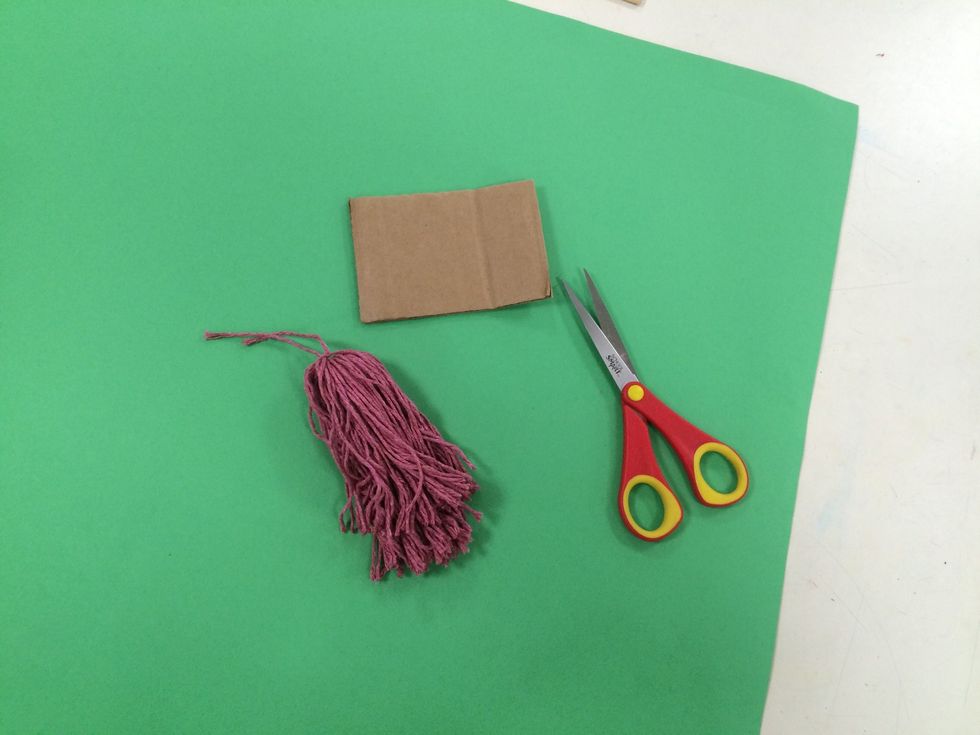 Save the cardboard to use for more tassels.