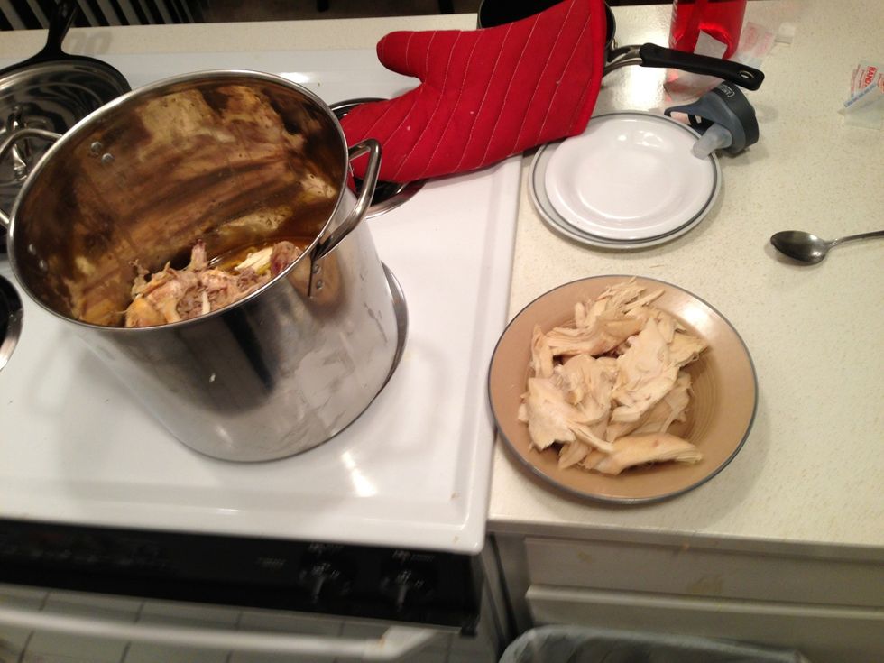 Save the meat for the soup tomorrow and for dinner to tonight. Putting the bones and left over chicken carcass in stock pot.