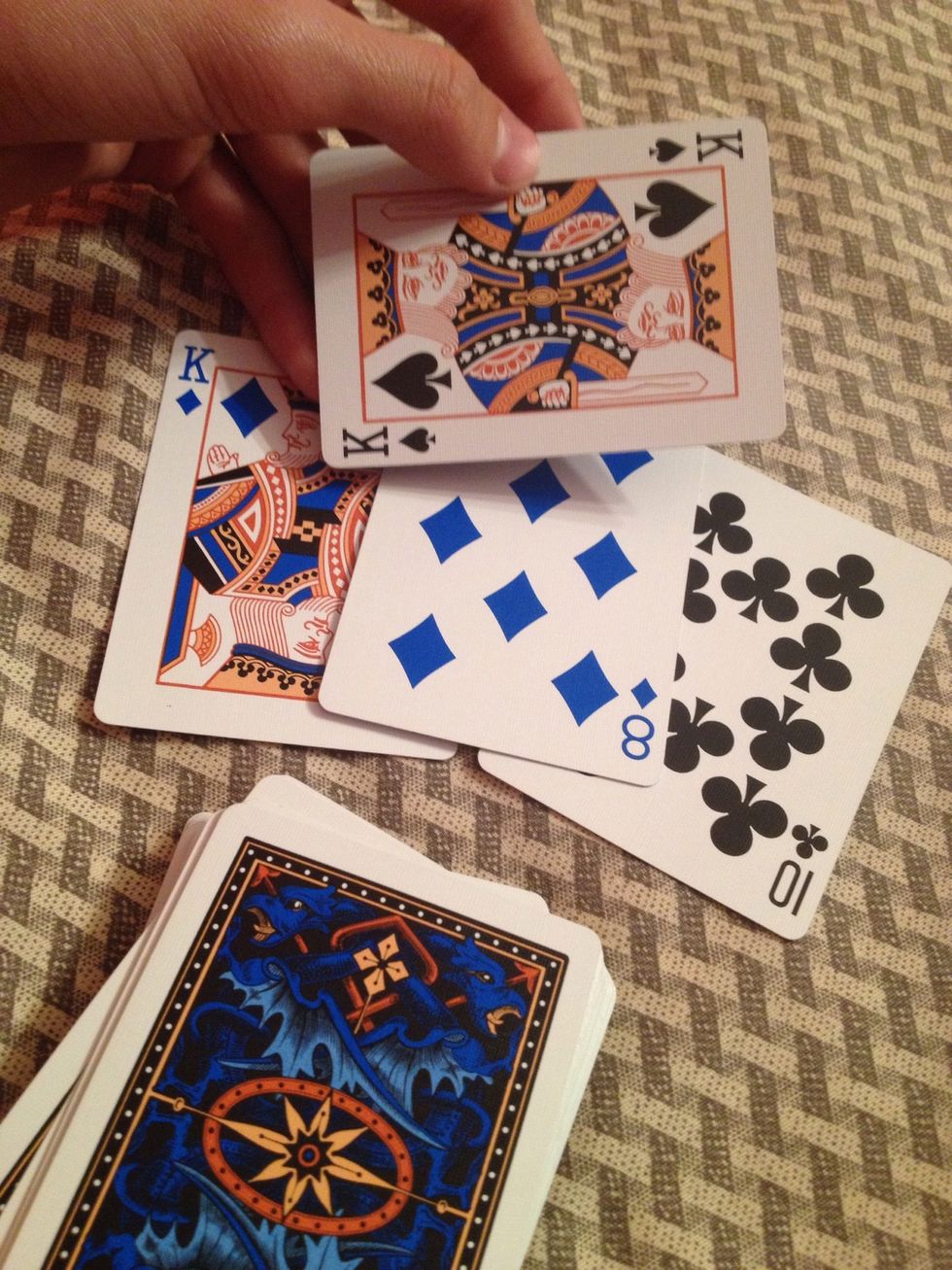 Say that you think the card away from the rest is their card.