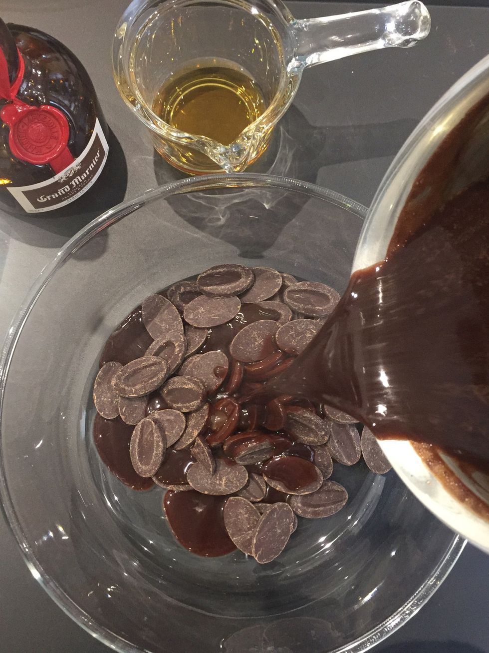 Scale 150 g chocolate. Pour the hot syrup over the chocolate. Wait 2-3 mins and mix(hand blender) until chocolate is melted and the mixture is homogenous. Leave to cool down..20-30 mins