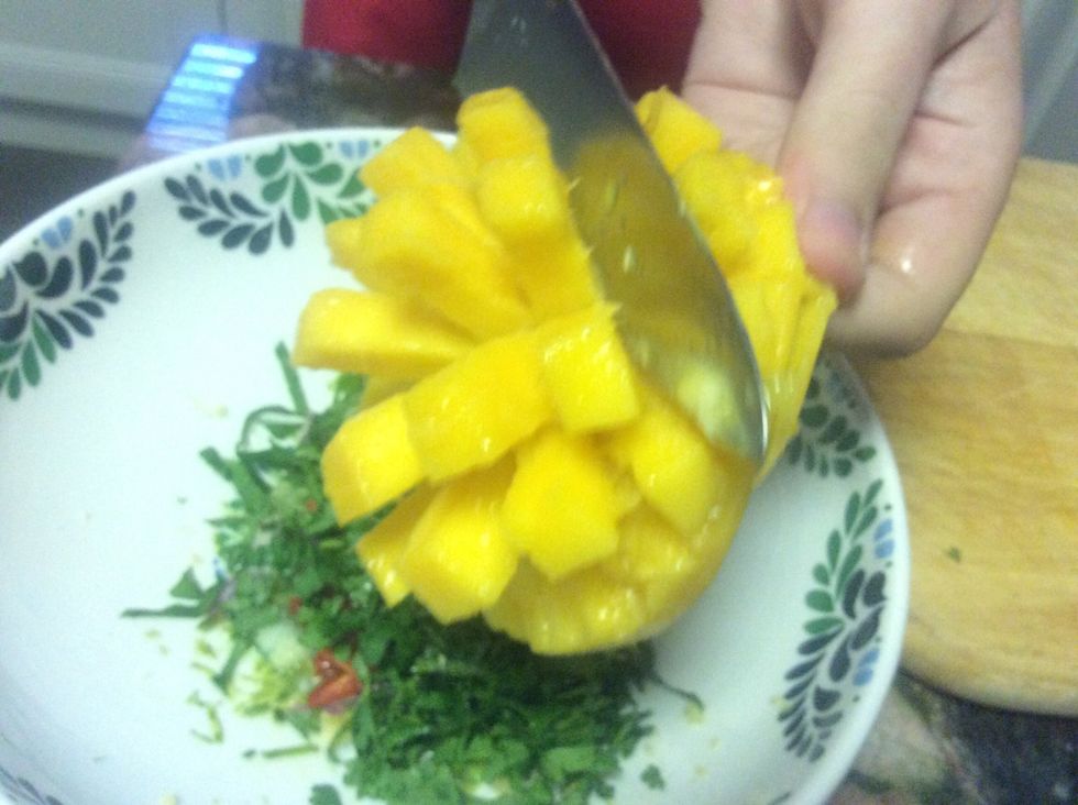 Scape the mango off into your bowl