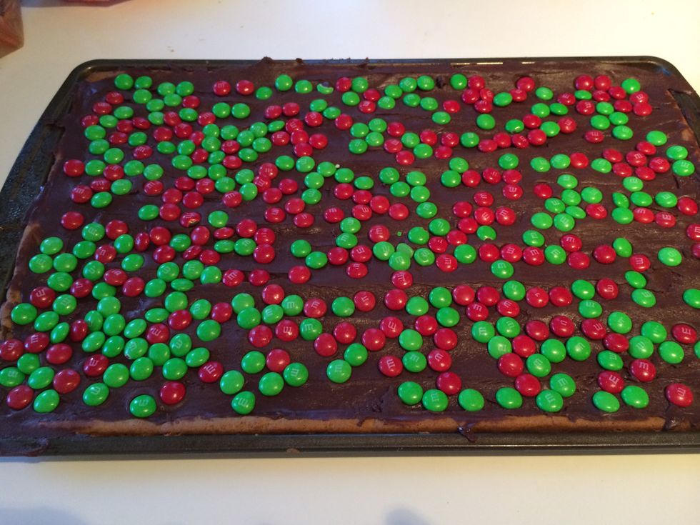 Scatter the candy so there is an even amount over the chocolate.  Press lightly so that the candy is pushed down into the fudge.