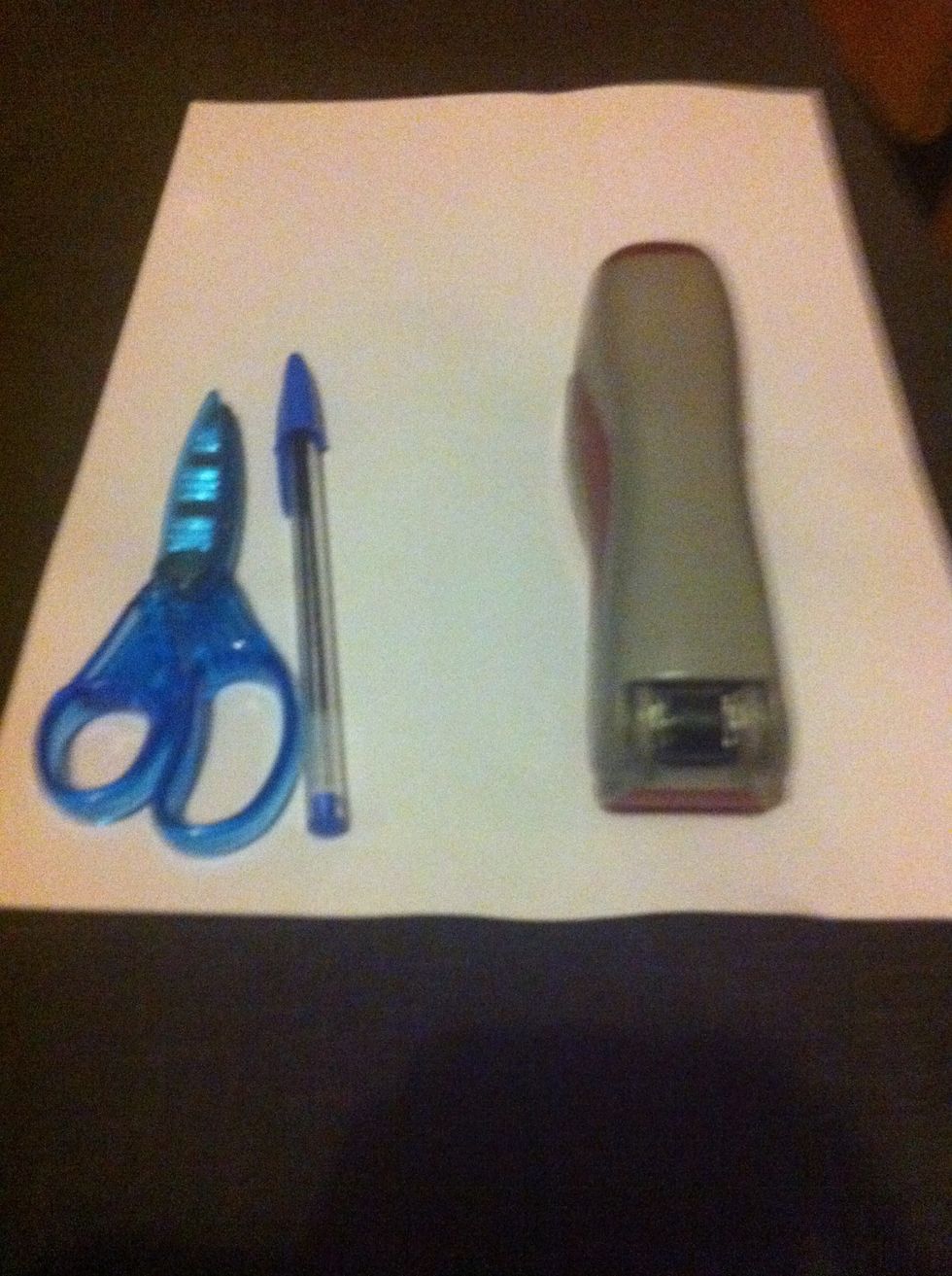 Scissors a pen a stapler or sticky tape